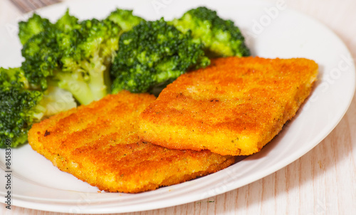 fried breaded fish fillets with broccoli