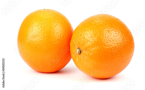 Two ripe oranges on a white background