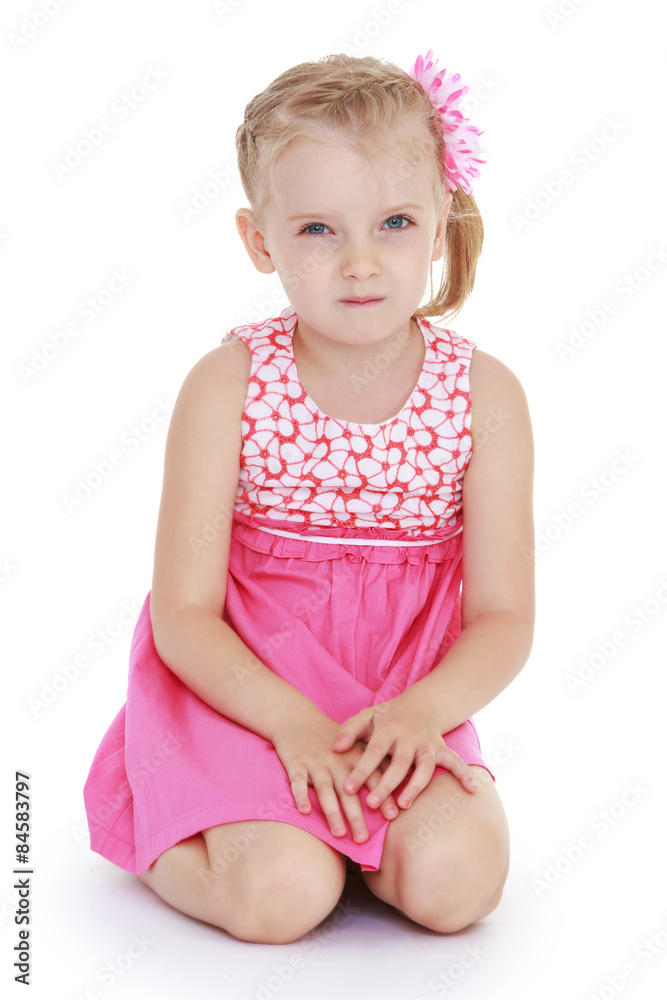 Beautiful fair-haired white-skinned little girl in a summer dres Beautiful fair-haired white-skinned little girl in a summer dres