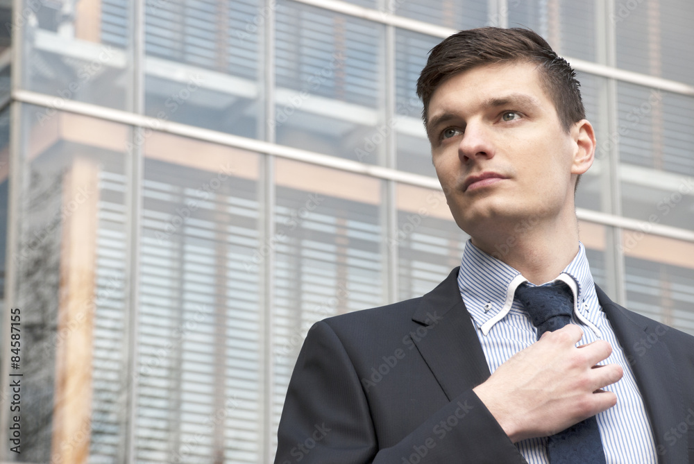 Portrait of an handsome young businessman in an urban setting Portrait of an handsome young businessman in an urban setting