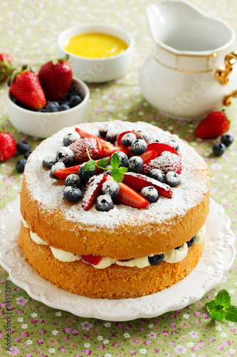 Genoise (cake) with cream, berries and lemon cream.