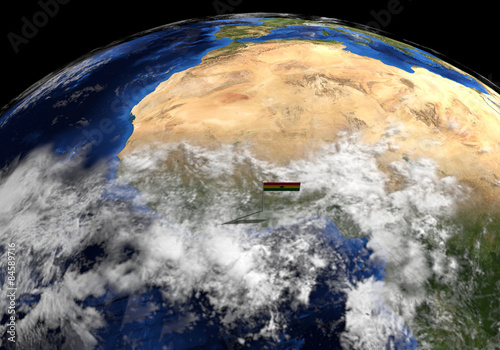Fototapeta Naklejka Na Ścianę i Meble -  Ghana flag on pole on earth globe illustration - Elements of this image furnished by NASA