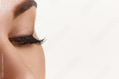 Close up of natural female eye isolated on white background
