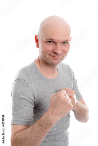 Fotografija funny young man with fist- hands