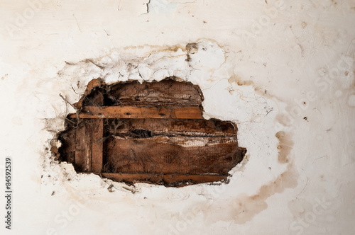Water damaged ceiling in an old abandoned house.