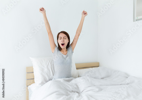 Woman yawning at morning