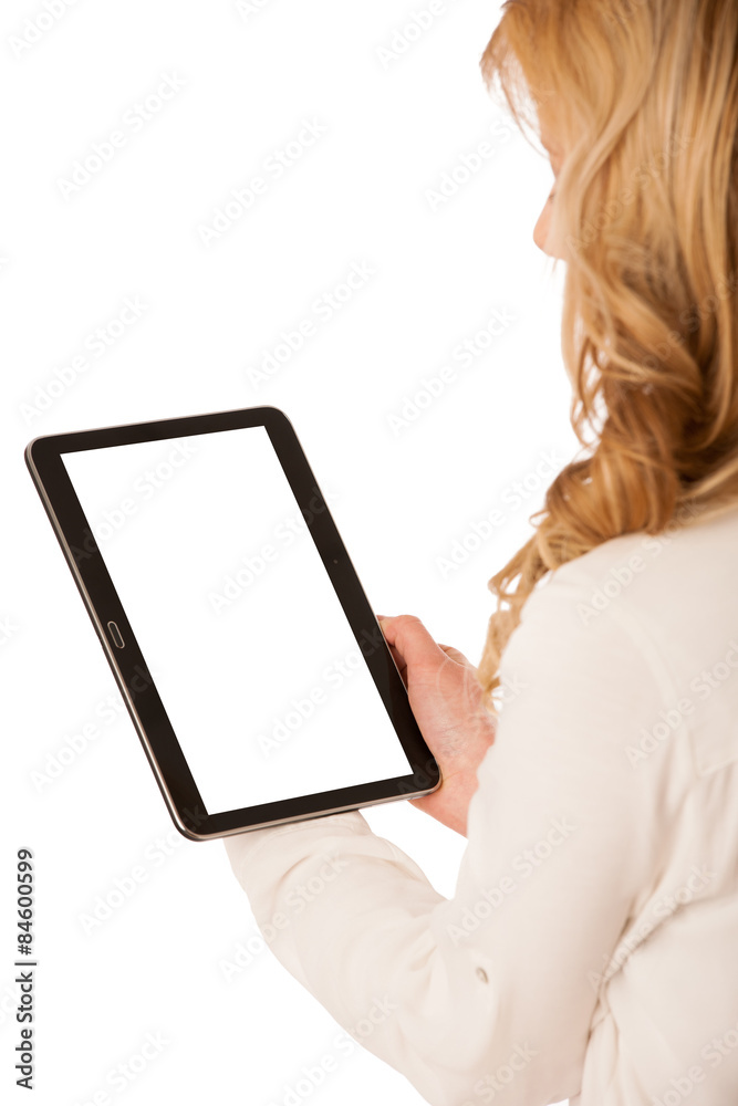 Beautiful young caucasian woman holding a tablet in her hand iso