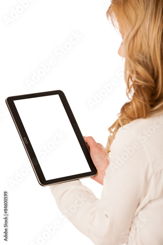 Beautiful young caucasian woman holding a tablet in her hand iso