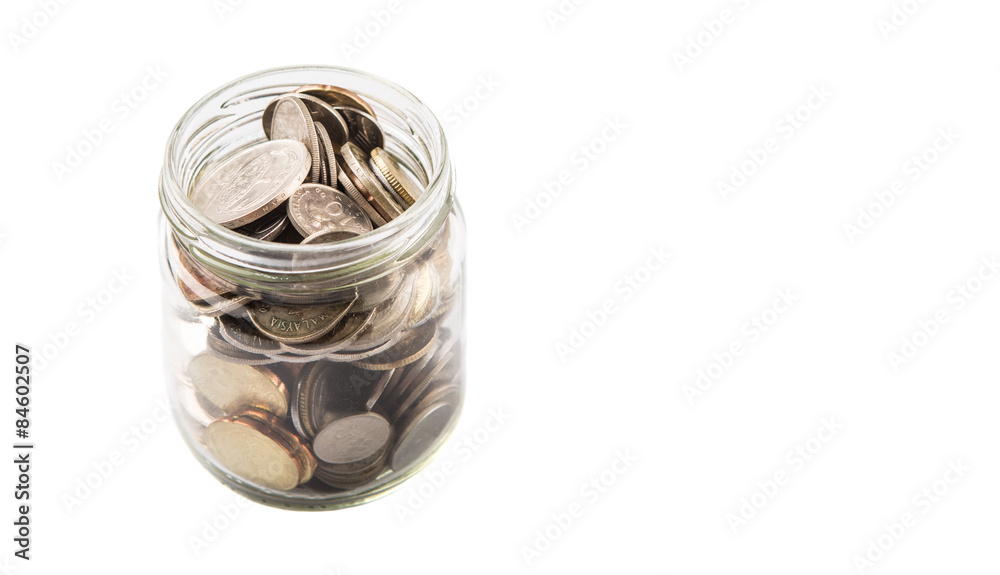 Malaysian coins in a mason jar over white background Malaysian coins in a mason jar over white background