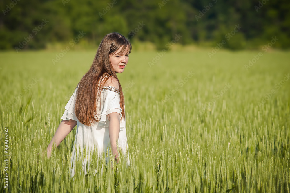 Woman hand touching wheat ears on the field Woman hand touching wheat ears on the field