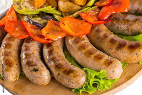 Grilled sausages with vegetables and sauce