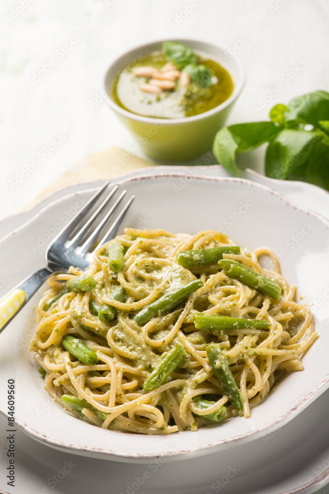 spaghetti with green beans and pesto sauce, selective focus