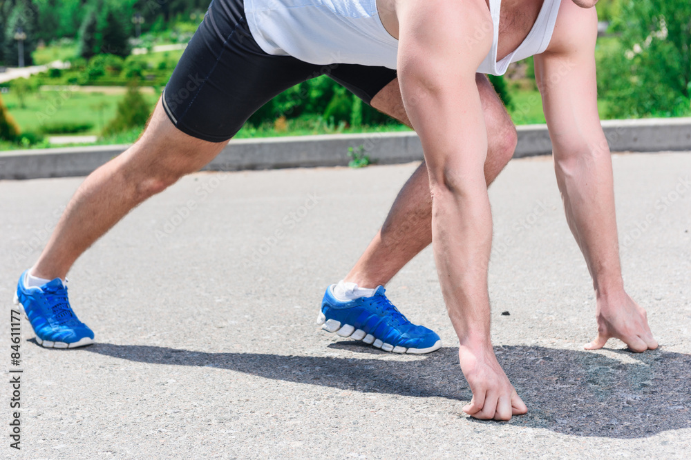 Handsome sportsman training outdoors Handsome sportsman training outdoors