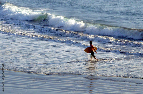 Surfer and ocean waves. 