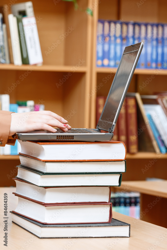 Woman hands in a library