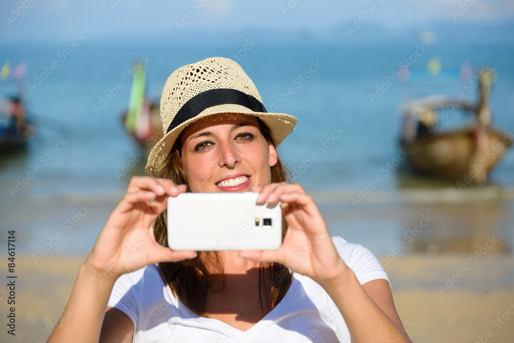 Tourist on Thailand travel taking photo with smartphone at Krabi