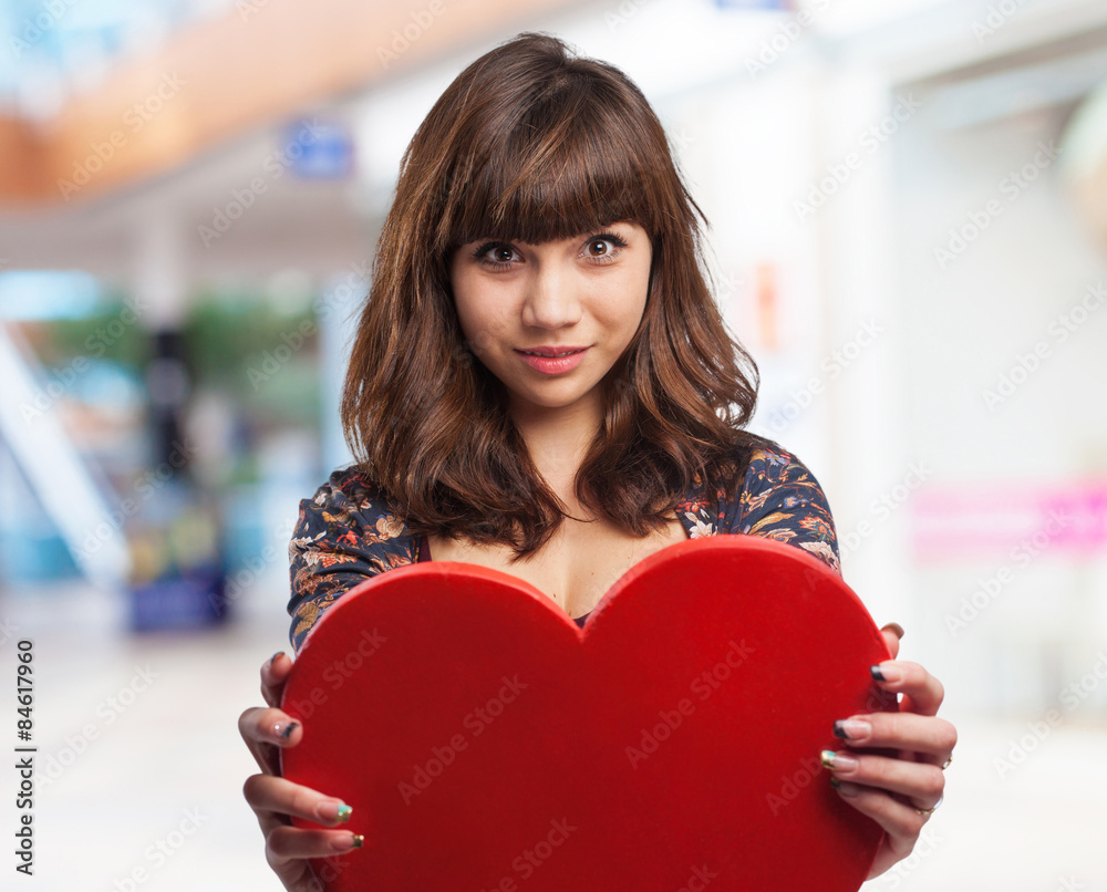 young woman holding a heart young woman holding a heart