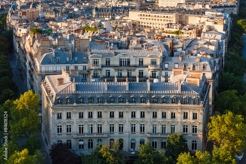 Haussmanian building with curvilinear facade and Paris Rooftops, France photo