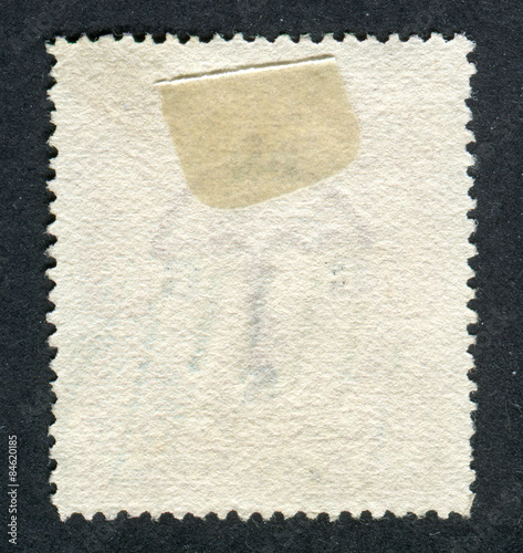 Reverse side of a postage stamp.