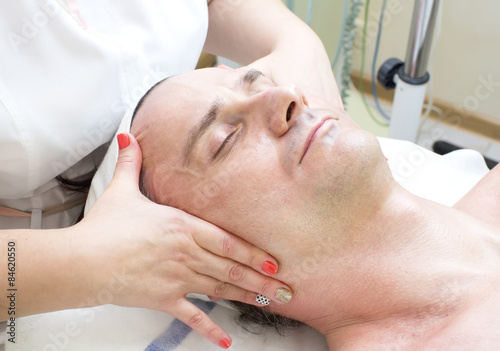 man in a beauty salon facial and massage