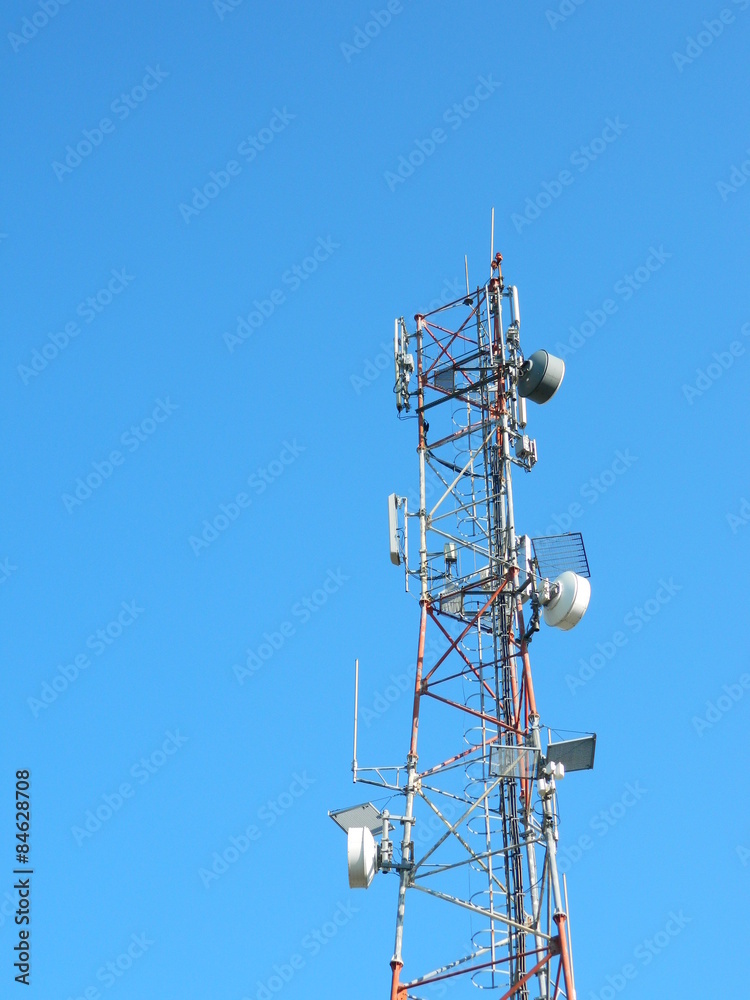 Communication Tower with Parabolic and GSM Antennas, LTE and Blue Sky. Communication Tower with Parabolic and GSM Antennas, LTE and Blue Sky.
