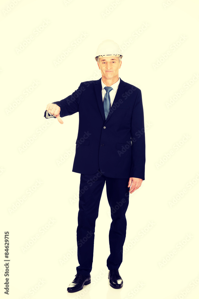 Construction businessman showing thumbs down