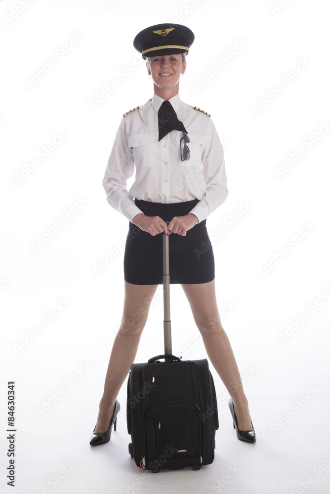 Female senior airline officer in uniform and flight bag Female senior airline officer in uniform and flight bag