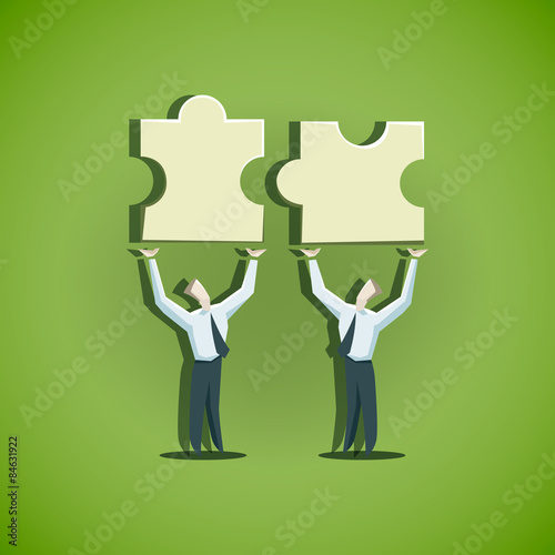 Two businessman trying to combine puzzle pieces