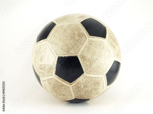 dirty old rubber soccer ball (beach soccer) isolated on white background