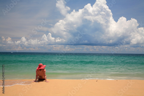 Woman relaxing on beach in Phuket
