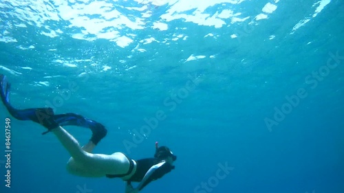 Wallpaper Mural Man dives into the depths of the blue water, snorkeling  Torontodigital.ca