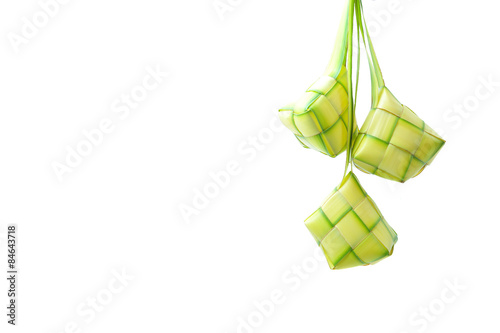 A diamond shaped traditional packed rice made from woven leaf. Ketupats, a natural rice casing made from coconut leaves for cooking rice on white background