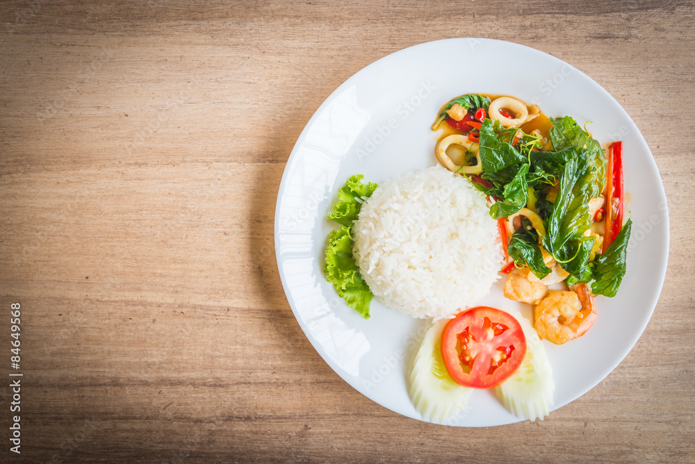 Spicy fried basil leaf with seafood and rice Spicy fried basil leaf with seafood and rice