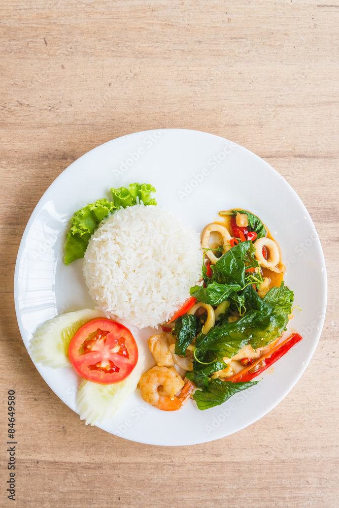 Spicy fried basil leaf with seafood and rice Spicy fried basil leaf with seafood and rice