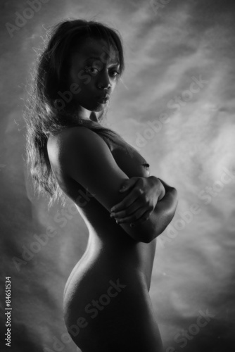 Young naked black woman in black and white