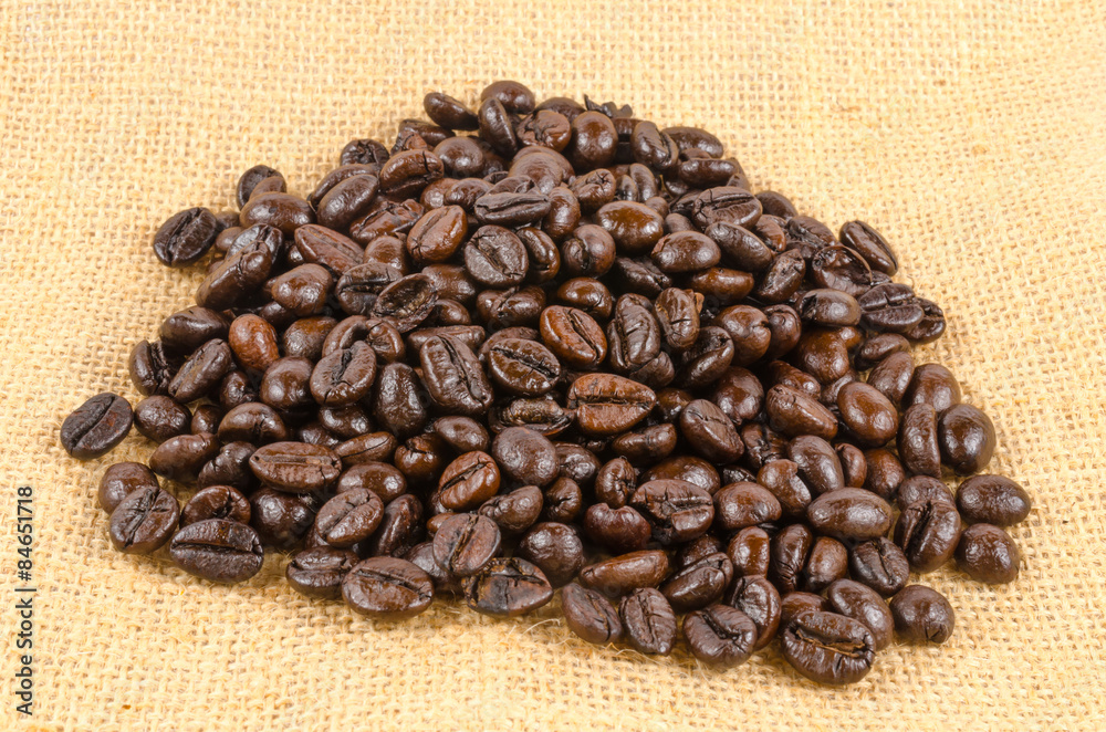 roasted coffee beans on sack cloth roasted coffee beans on sack cloth
