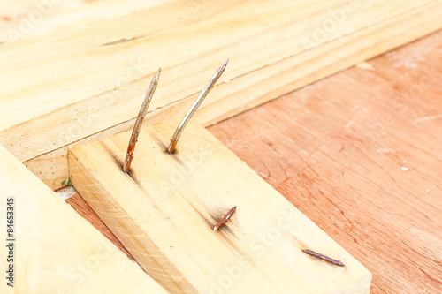 bent nail on wood