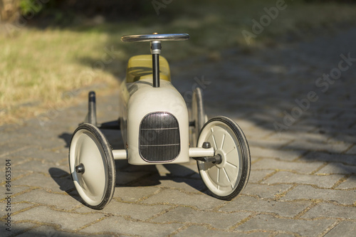 old metal car for children from the 19 th century photo