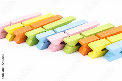 Group of colorful wooden clothespins isolated on white backgroun