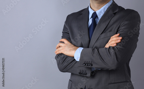Businessman standing with arms crossed