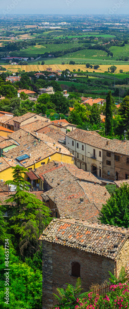 landscape with roofs of houses in small tuscan town in province