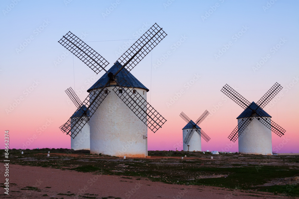 Group of  windmills at field in evening