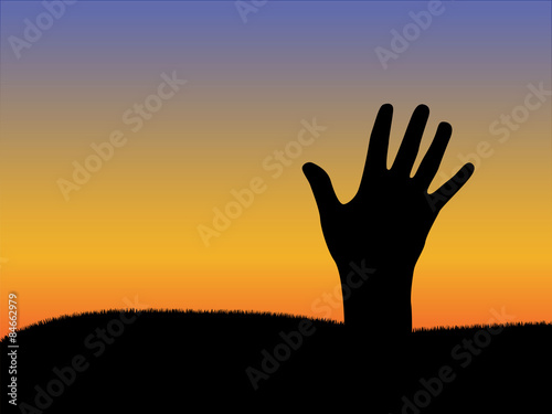 Hand from ground silhouette with sunset sky