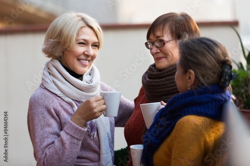 Tableau sur toile Senior women drinking tea at balcony