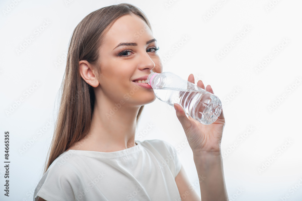 Beautiful healthy young woman is very thirsty Beautiful healthy young woman is very thirsty