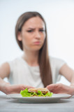 Woman does not want to eat unhealthy food
