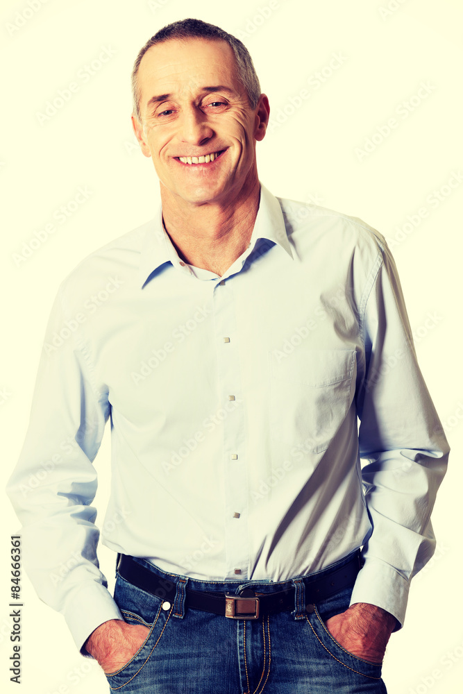 Handsome man with hands in pockets
