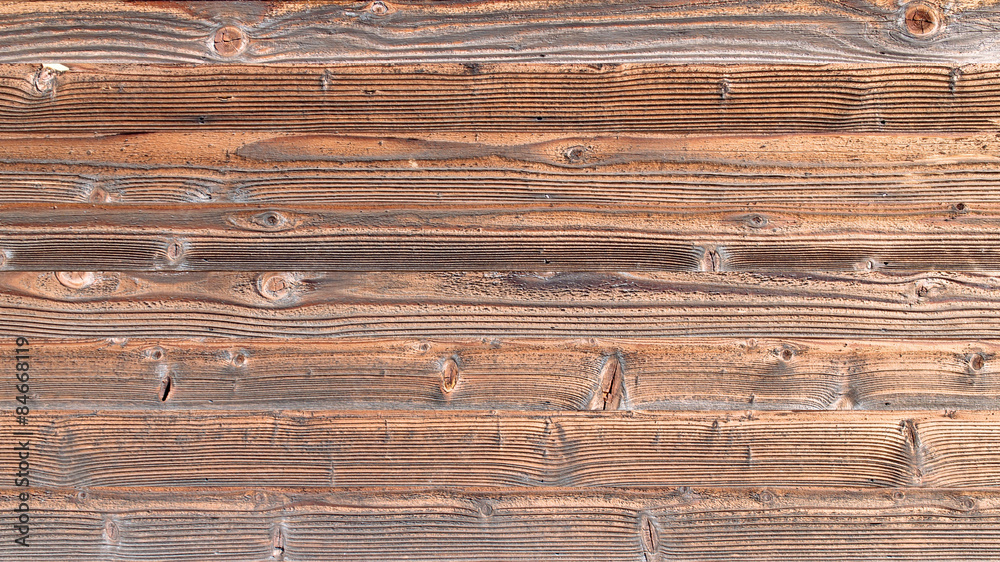 Naklejka premium Rough brown wood plank. Wooden texture background.