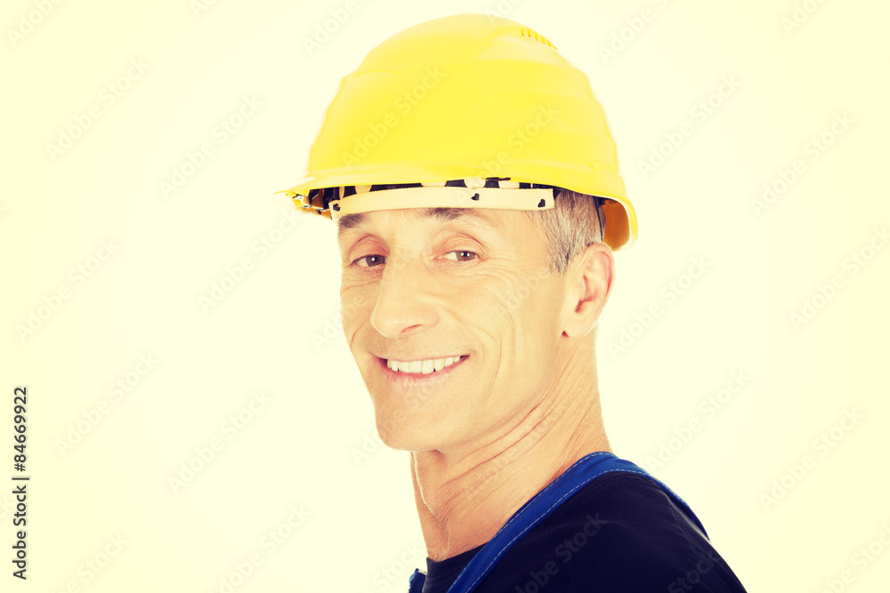 Smiling builder with a safety helmet Smiling builder with a safety helmet