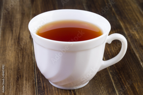 white cup of black tea